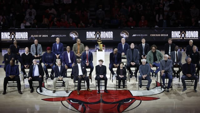 Chicago Bulls class of 2024 Ring of Honor inductees from left to right, (Back Row) Jim Cleamons, Erik Heiland, Ivika Duran, Clarence Gaines, Jr., John Ligmanowski, Chip Schaefer, Jim Stack, Al Vermeil (Middle Row) Randy Brown, Jud Buechler, Jason Coffey, James Edwards, Jack Haley, Jr., Ron Harper, Bill Wennington, Luc Longley, John Salley, Steve Kerr (Front Row) Artis Gilmore, Matt Kerr, Greg Klein, Bob Love, JJ Parrish, Thelma Krause, Chris Winter, Phil Jackson, Toni Kukoc are honored during the inaugural ceremony at halftime of a game between the Bulls and Golden State Warriors at United Center.